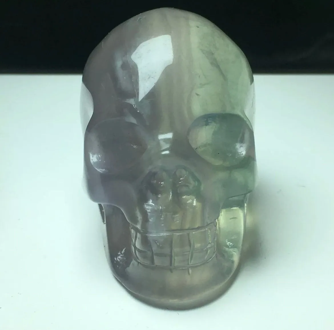 Exquisite fluorite gemstone carved Skull